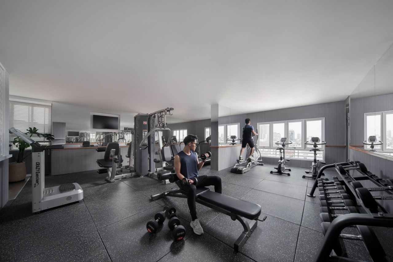 A Rooftop and Wellness Stay in Central Saigon: Inside Silverland Mây 6 Gym with Saigon skyline view at Silverland Mây Hotel, 12A floor