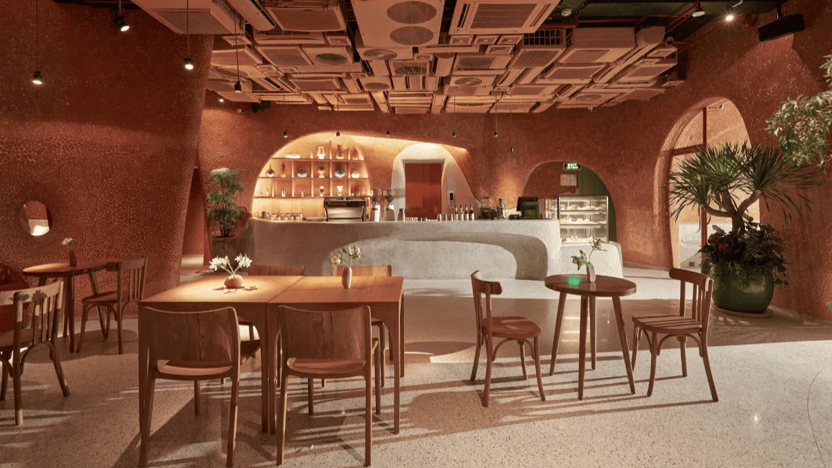A Coffee Shop Steps From Ben Thanh Metro Station 3 Tables under curved terracotta arches inside Bason Café Ben Thanh in District 1 Saigon