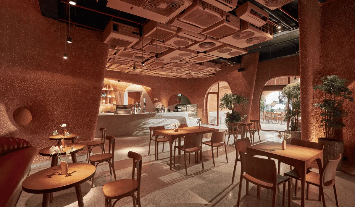 Best Coffee Shops for a Business Meeting in District 1 2 The curved terrazzo bar counter at Bason Café Ben Thanh under a sculptural terracotta ceiling