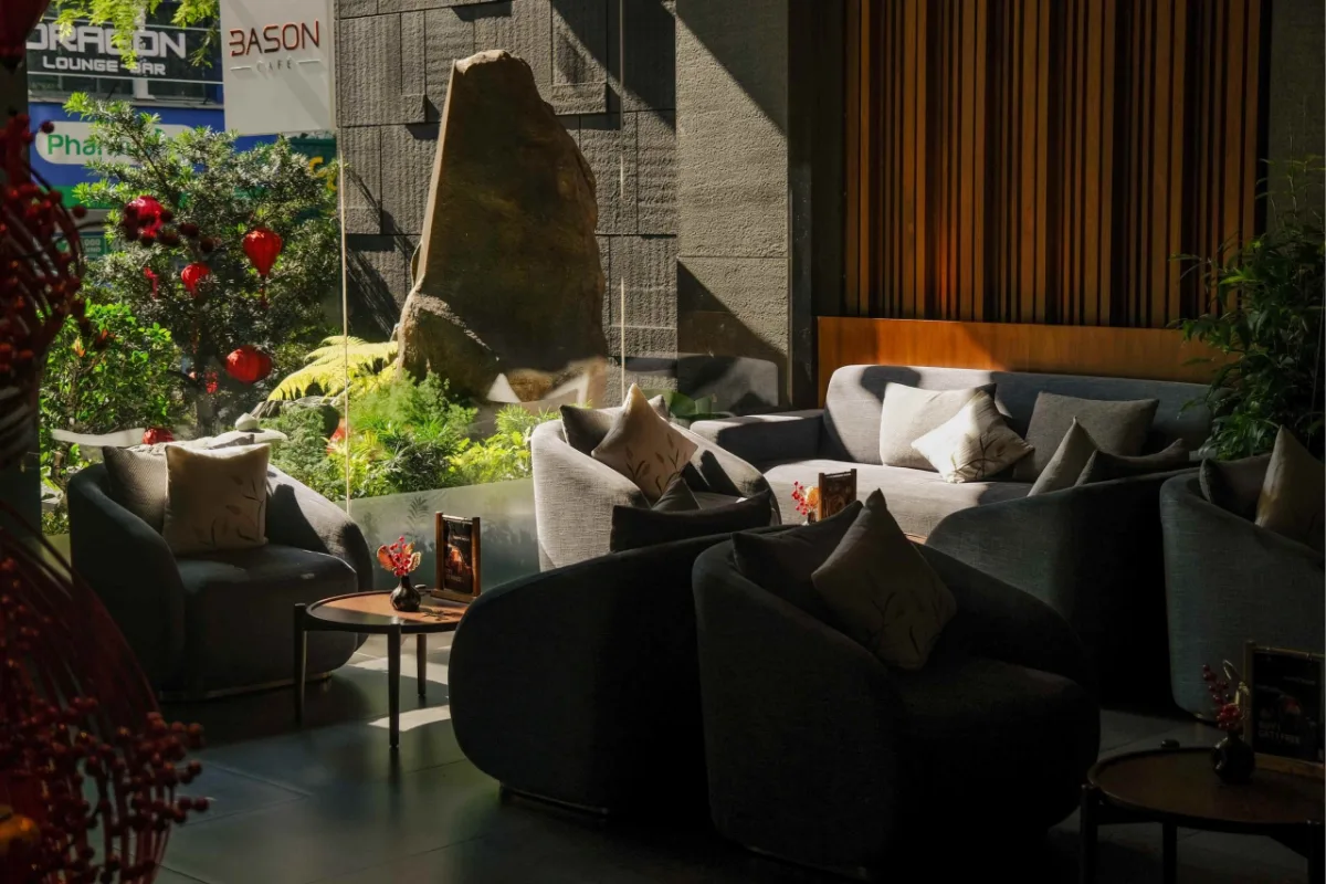 Best Coffee Shops for a Business Meeting in District 1 5 The lounge seating at Bason Café Sakyo with a view of a Japanese-style garden stone and red lanterns