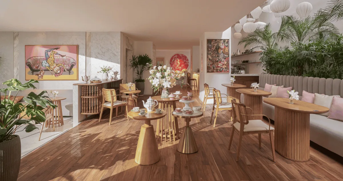 Best Coffee Shops for a Business Meeting in District 1 3 The interior of Bason Café Thi Sach with warm wood tones, paper lanterns, and plants