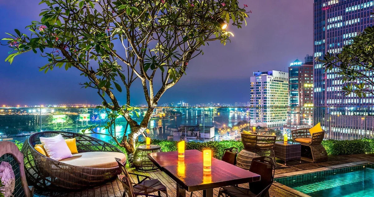 Evening view towards the Saigon River from the rooftop bar during a Silverland Jolie fireworks stay