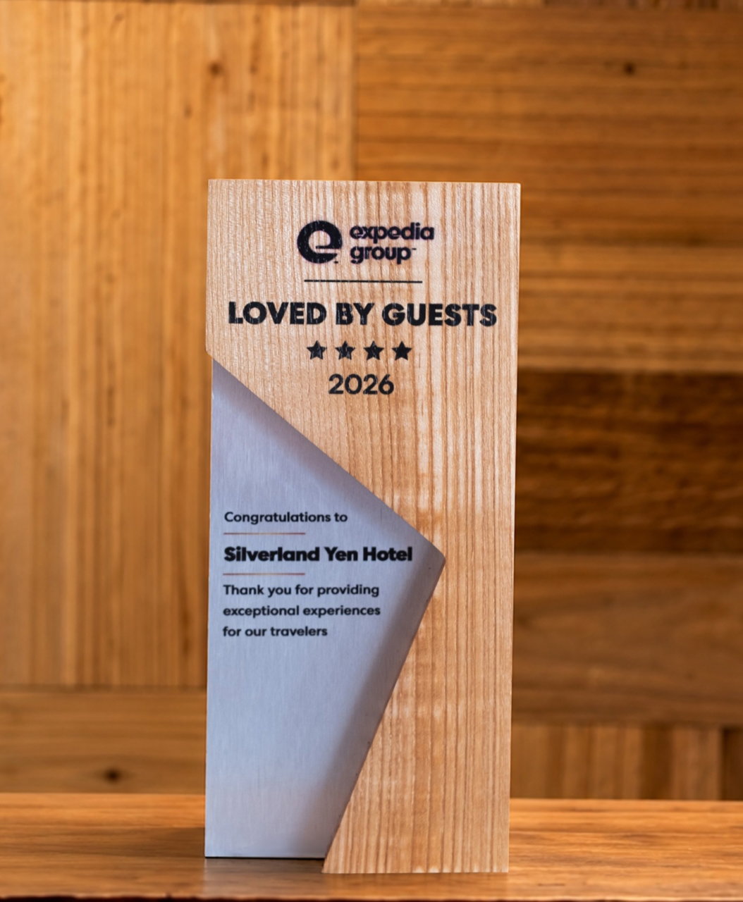Silverland Yen Recognised Loved by Guests 2026 award by Expedia Group 1 Expedia Group Loved by Guests 2026 award trophy presented to Silverland Yen Hotel