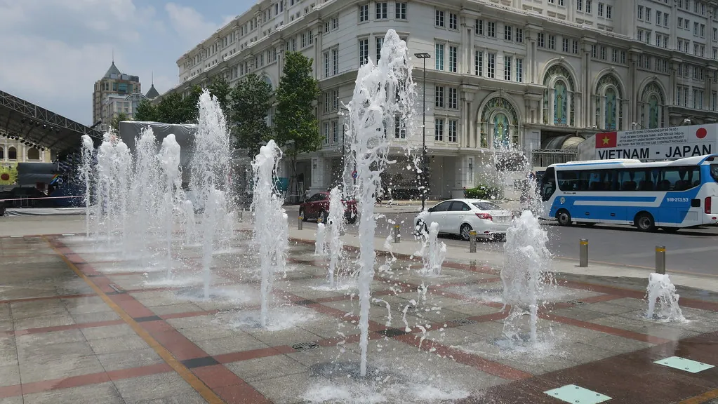 Fountain on Nguyen Hue Walking Street in downtown Saigon, surrounded by the pedestrian plaza